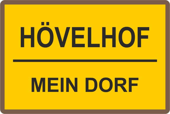 Expressabzeichen Ortspin bronze im Ortsschild-Design mit Hövelhof und Mein Dorf Rechteckiger Ortspin als Expressabzeichen in Bronze mit gelbem Ortsschild-Motiv, schwarzem Rand sowie den Aufschriften Hövelhof und Mein Dorf.