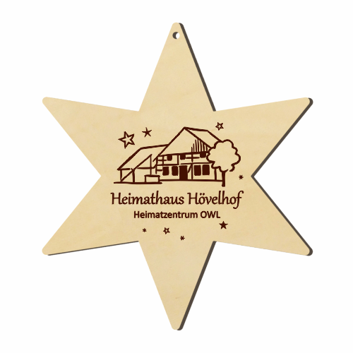 Hövelhof Heimathaus Holzstern mit Gravur Sternförmiger Holzanhänger mit Bohrung und Gravur des Heimathauses Hövelhof sowie dem Schriftzug „Heimathaus Hövelhof Heimatzentrum OWL“.
