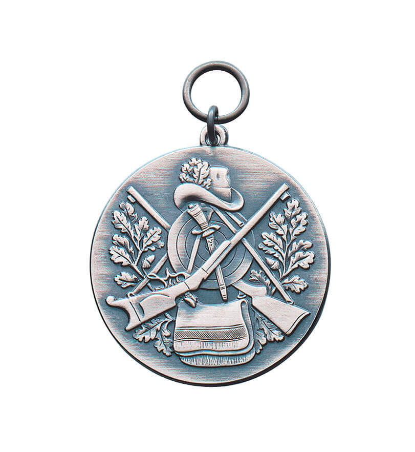 Medaille vergoldet für Schützenverein mit Schützenhut, Gewehren und Eichenlaub Runde Medaille vergoldet mit Öse und Ring, reliefiertem Schützenhut, gekreuzten Gewehren, Zielscheibe, Eichenlaub und Tasche als Schützenmotiv.