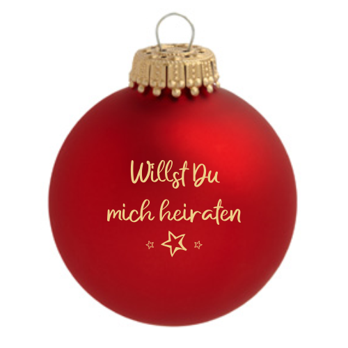 Schloß-Neuhaus Weihnachtskugel in Rot mit Schriftzug Rote Schloß-Neuhaus Weihnachtskugel aus Glas mit goldenem Aufhänger und dem Aufdruck „Willst Du mich heiraten“ sowie kleinem Sternmotiv.