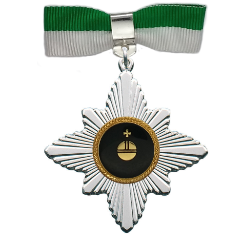 Pfänderorden Apfel mit grün-weißer Stoffschleife Pfänderorden „Apfel“ in versilberter Sternform mit schwarzer runder Mitte und goldfarbener Apfel-Auflage, an grün-weißer Stoffschleife mit Sicherheitsnadel befestigt