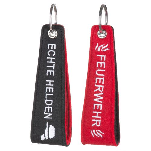 Filz Schlüsselanhänger Feuerwehr/Echte Helden in Schwarz und Rot Zwei Filz Schlüsselanhänger Feuerwehr/Echte Helden mit Metallring, einer schwarz mit weißem Schriftzug ECHTE HELDEN, einer rot mit weißem Schriftzug FEUERWEHR, jeweils mit kontrastierender Rückseite